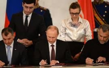 بوتين يوقع رسميا على مرسوم ضم القرم إلى الاتحاد الروسي