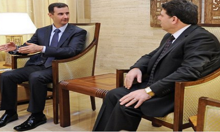 «الأسد» يعين «الحلقي» رئيسا للحكومة السورية الجديدة