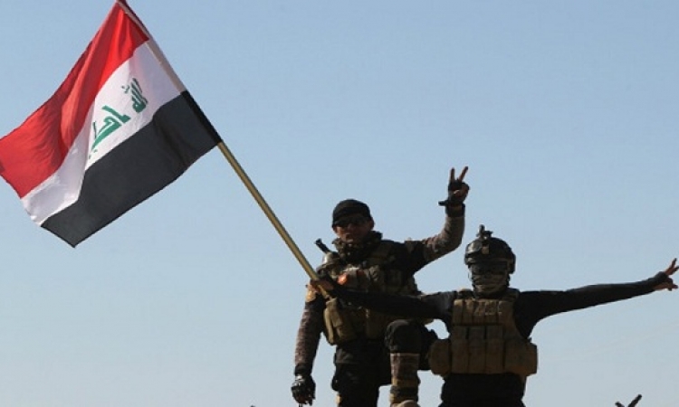 رفع العلم العراقى فوق مسجد البغدادى بوسط الموصل