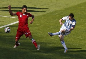 Argentina's Messi scores a goal past Iran's Ghoochannejhad during their 2014 World Cup Group F soccer match at the Mineirao stadium in Belo Horizonte