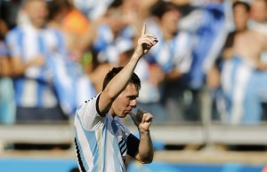 Argentina's Lionel Messi celebrates after scoring a goal during the 2014 World Cup Group F soccer match between Argentina and Iran at the the Mineirao stadium